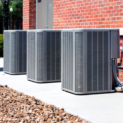 HVAC SuppliesCentral air conditioners outside of a brick building